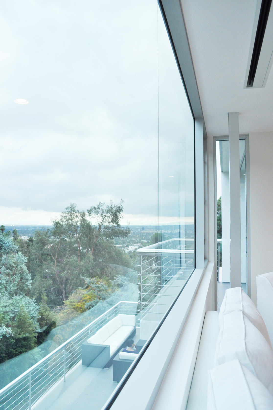 A building interior picture looking outside of the window.