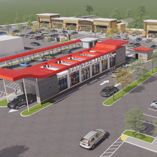 A perspective view of the carwash building exterior with red canopy.