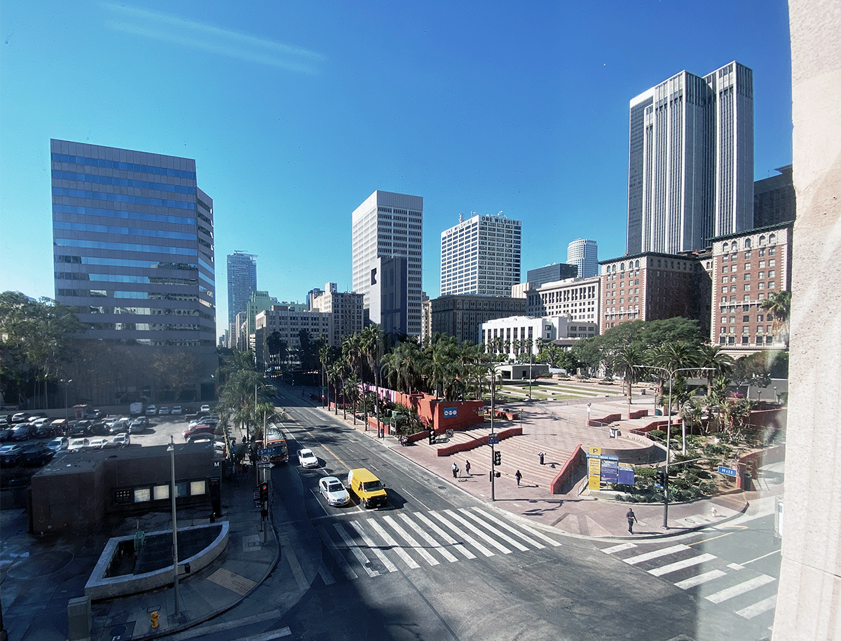 LA downtown Hill Street picture. Pershing square and people walking on the street.