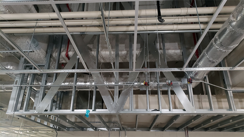 A construction photo of the business office. Metal ceiling frame.