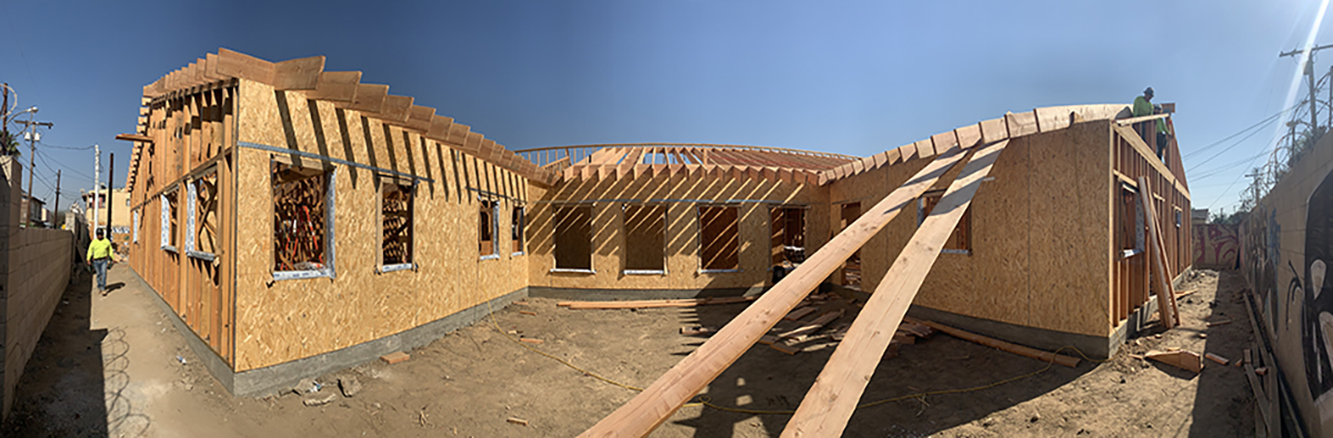 A construction photo of adult residential building. Wood framing and plywood.